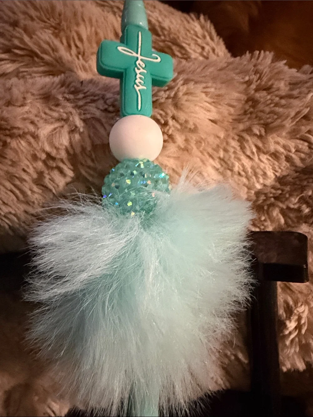FAITH Fluffy Teal Cross Top Pen – $8 Each. Features Turquoise Puff Accessory